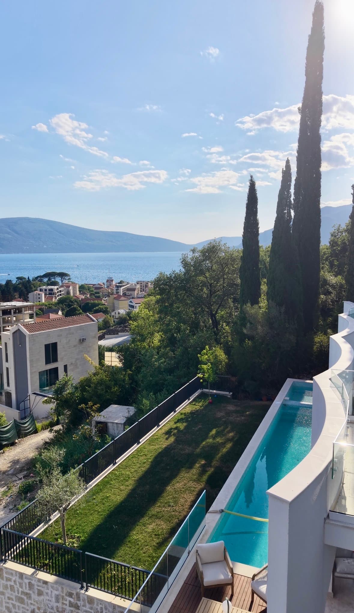 Pool ledge overlooking the coastal town and bay